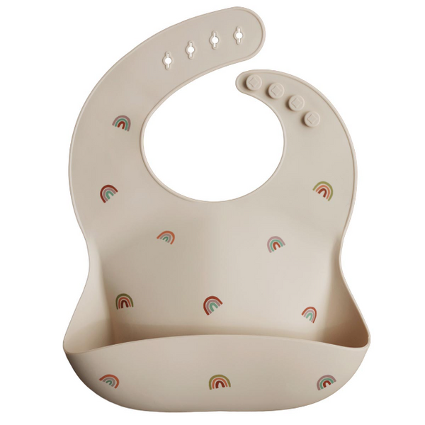 Beige bib with rainbow patterns on a white background