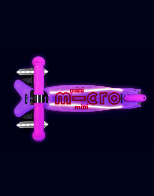 Purple scooter with 'micro' branding on a black background