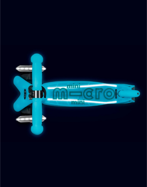 Blue scooter with 'micro' branding on a black background