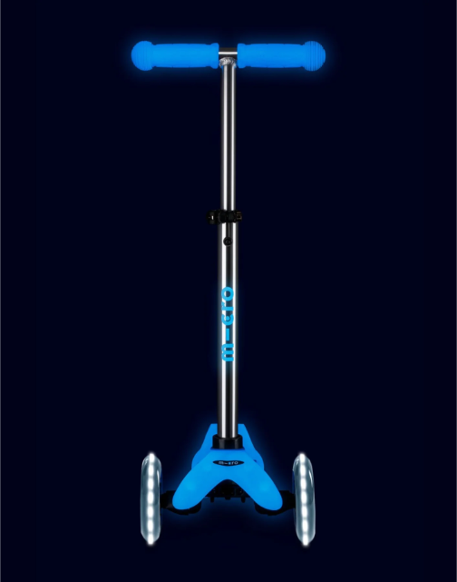 Blue scooter with a black background