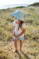 SIDE VIEW OF GIRL WEARING ACORN Frayed Bucket Hat - Seafoam