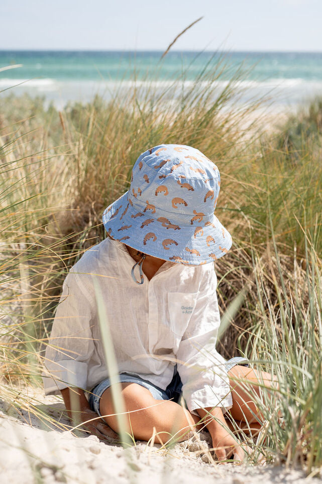 TOP VIEW OF CHILD WEARING ACORN Platapus Wide Brim Bucket Hat