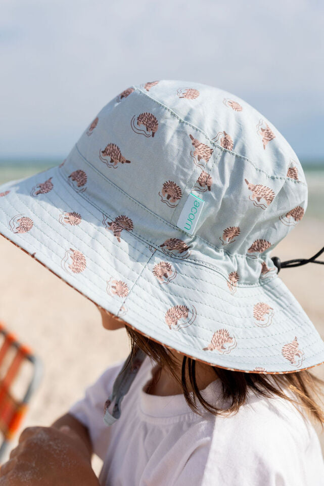 SIDE VIEW OF CHILD WEARING ACORN Echidna Wide Brim Bucket Hat