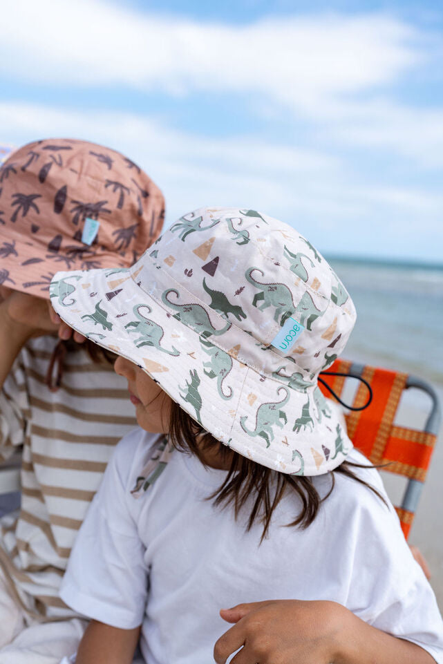 SIDE VIEW OF CHILD WEARING ACORN Dino Delight Wide Brim Bucket Hat