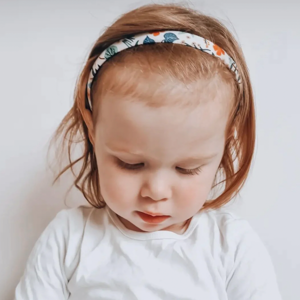 Toddler wearing JOSIE JOAN'S Goldie Alice headband