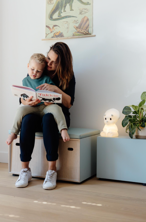 Mum reading child a story by the MR MARIA Mira First Light Lamp