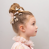 Child wearing Mimi & Lula hair clips from their Swanlake collection - side view