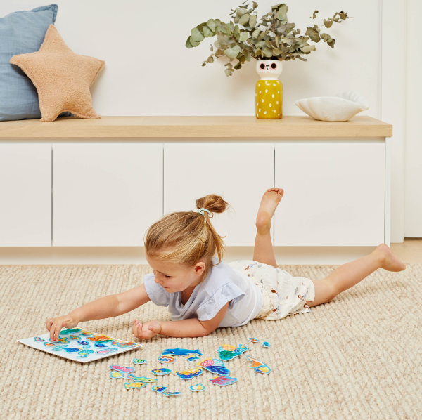 Child playing on the floor with the TIGER TRIBE Felt Stories - Under the Sea