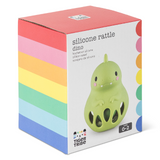 Box packaging of a silicone rattle dino toy with colorful stripes and Tiger Tribe branding.