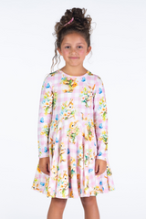 Girl wearing ROCK YOUR BABY Bunny Bouquet Waisted Dress