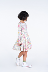 Side view of girl wearing the ROCK YOUR BABY Bunny Waisted Dress