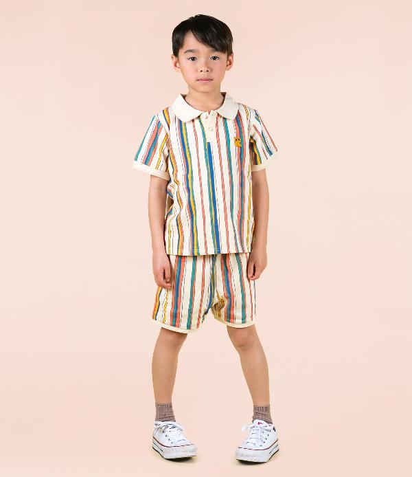 Boy wearing ROCK YOUR BABY Stripe Polo Shorts and matching polo shirt - studio shot