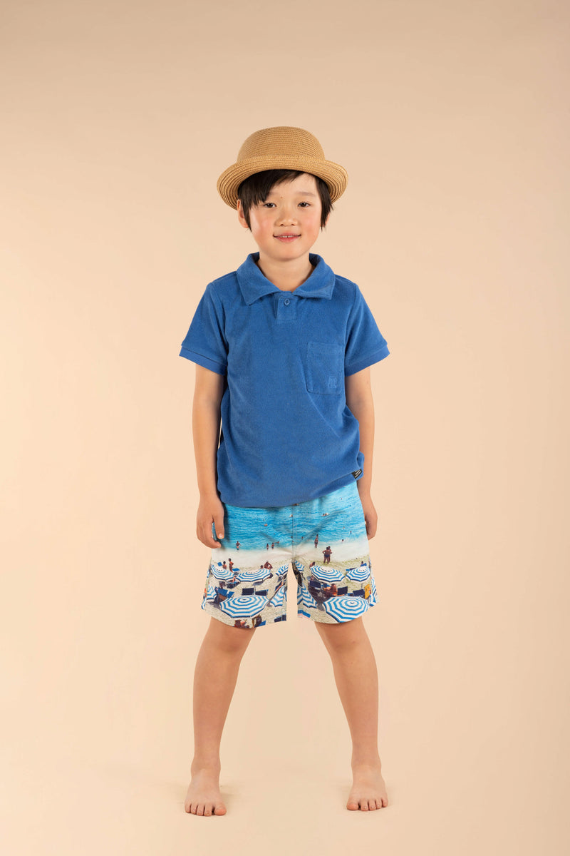 Boy wearing ROCK YOUR BABY Blue Terry Towelling Polo T-Shirt studio image