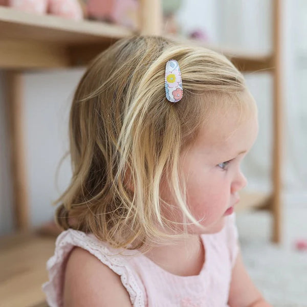 Toddler wearing the JOSIE JOAN'S Little Joy Hair Clips - Limited Edition