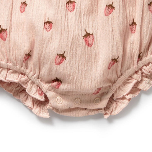 Pink baby bloomers with strawberry pattern on a white background