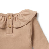 Detail view of back button opening WILSON + FRENCHY Fawn Organic Ruffle Top