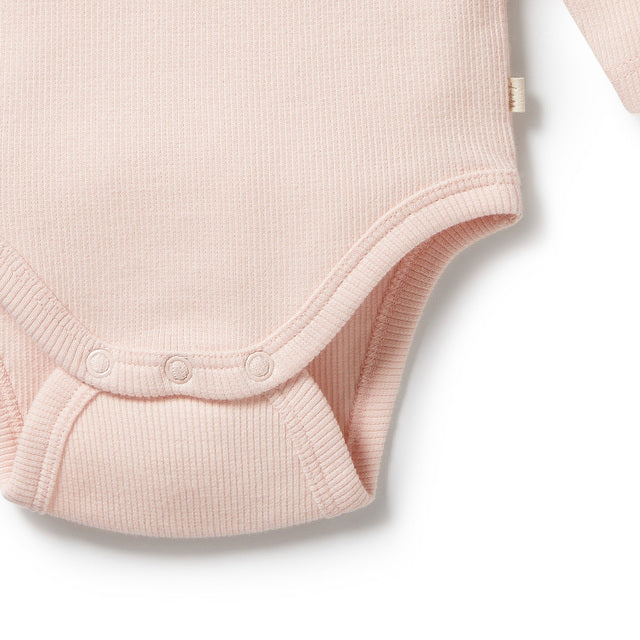Detail view of snap closures WILSON + FRENCHY Pink Organic Bodysuit