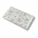Floral patterned fabric on a light blue background