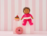 OLLI ELLA Dinky Dinkum Doll Sadie Sprinkles sitting on a box with a cupcake and donut