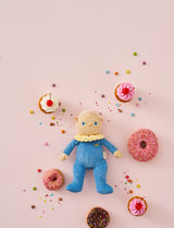 OLLI ELLA Dinky Dinkum Doll Bonnie Buttercream lying down surrounded by donuts