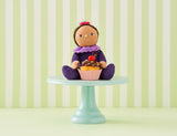 OLLI ELLA Dinky Dinkum Doll Freya Fondant sitting on a cake stand with a cupcake