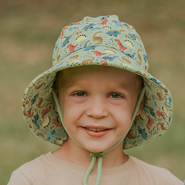 Child wearing BEDHEAD HATS Kids Classic Bucket Sun Hat - Dino