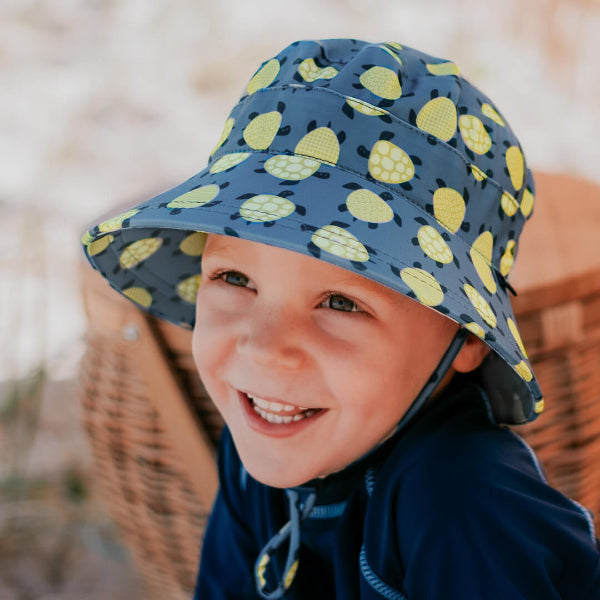 Child wearing BEDHEAD HATS Classic Swim Bucket Hat - Turtle