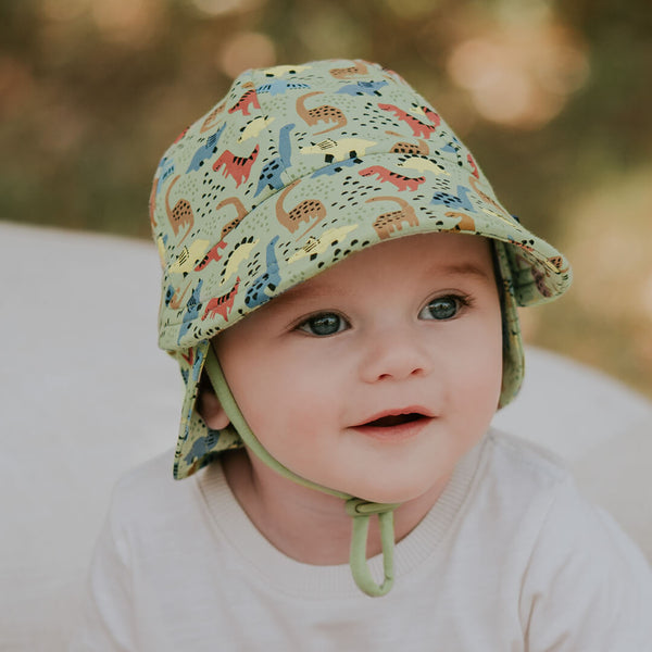 Baby wearing BEDHEAD HATS Legionnaire Flap Sun Hat - Dino