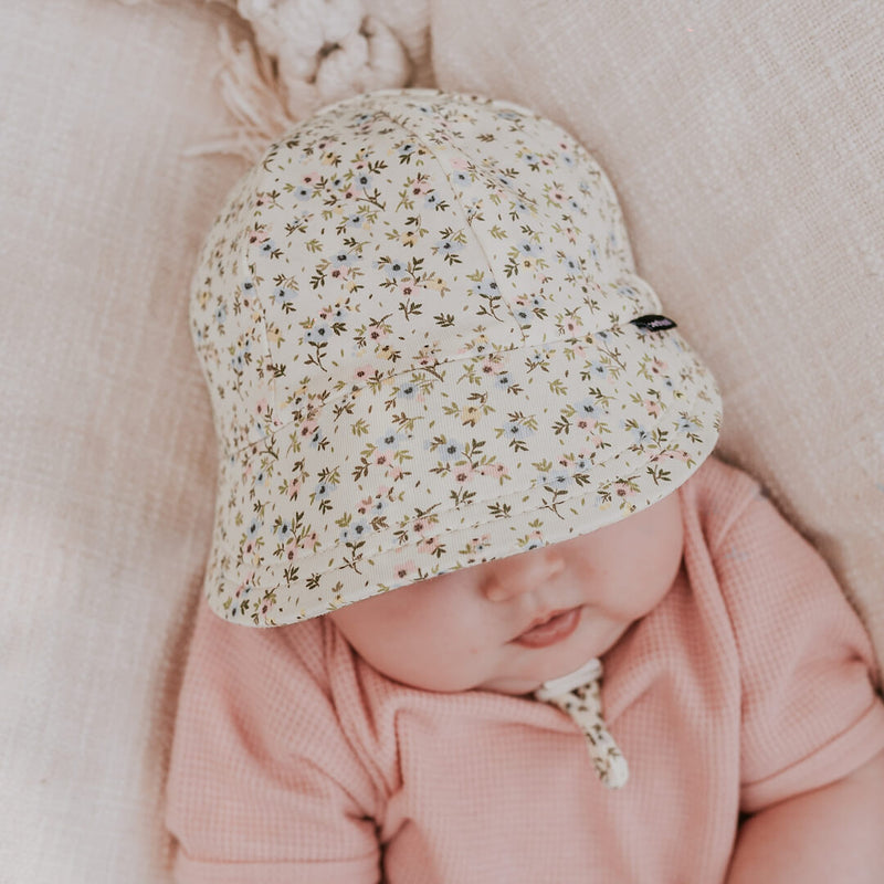 Top view of baby wearing BEDHEAD HATS Legionnaire Flap Sun Hat - Charlotte