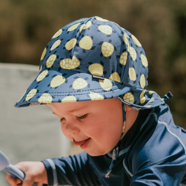 Side view of baby wearing BEDHEAD HATS Swim Legionnaire Hat - Turtle