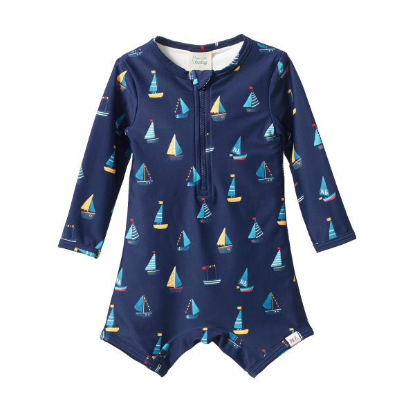 Navy blue children's swimsuit with sailboat pattern on a white background