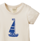 Beige baby onesie with blue sailboat design 
