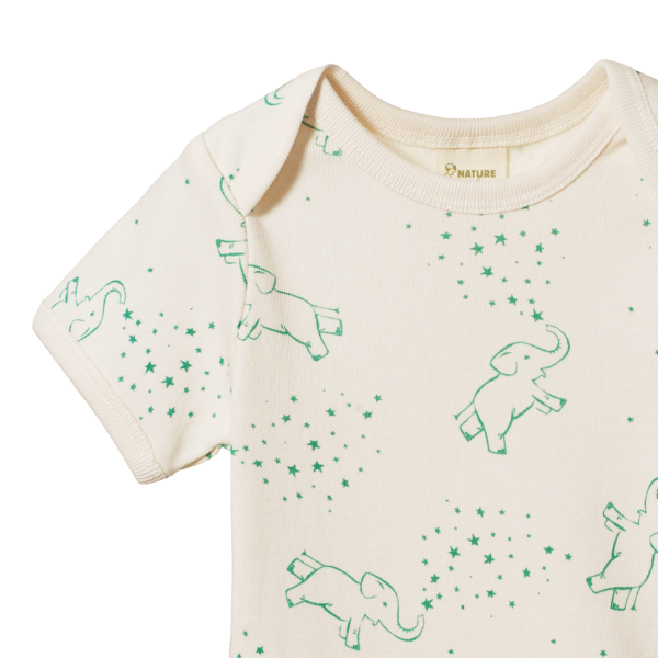 Beige t-shirt with green elephant patterns on a white background