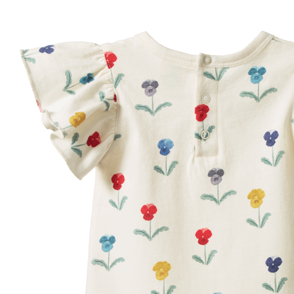 Back view of Baby onesie with floral patterns on a white background showing snap neck closures and frill sleeve