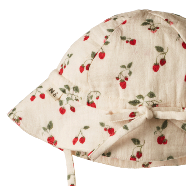 back view of hat with strawberry pattern on a white background
