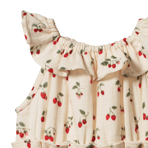 Baby romper with strawberry pattern on a white background