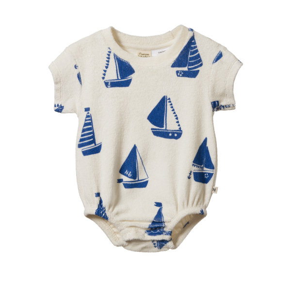 Baby romper with blue sailboat pattern on a white background
