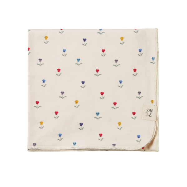 Floral patterned blanket on a white background