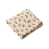 Folded fabric with strawberry pattern on a white background