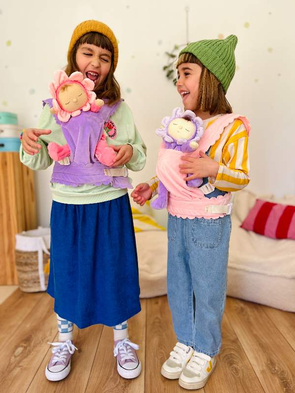 Kids wearing OLLI ELLA Dinkum Dolls Petal Carriers in Lavender and Fuchsia