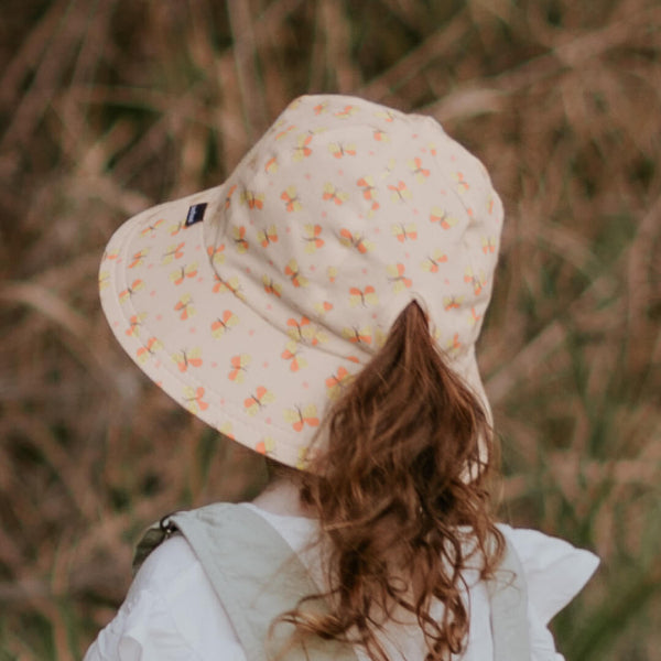 Back view of girl wearing BEDHEAD HATS Ponytail Bucket Sun Hat - Butterfly