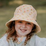 Girl wearing BEDHEAD HATS Ponytail Bucket Sun Hat - Butterfly