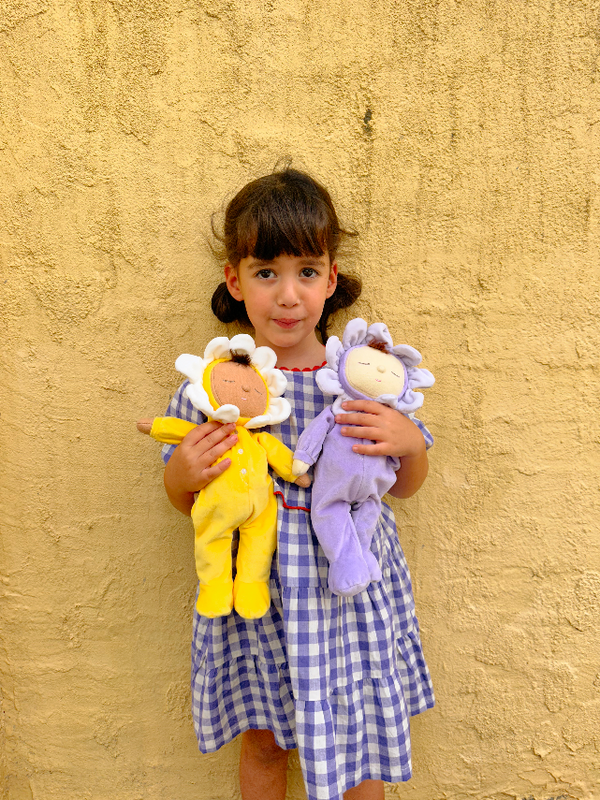 Child holding OLLI ELLA Dozy Dinkum Pip - Buttercup and Lavender