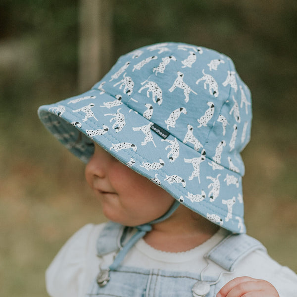 Side view of child wearing BEDHEAD HATS Toddler Bucket Sun Hat - Dalmation