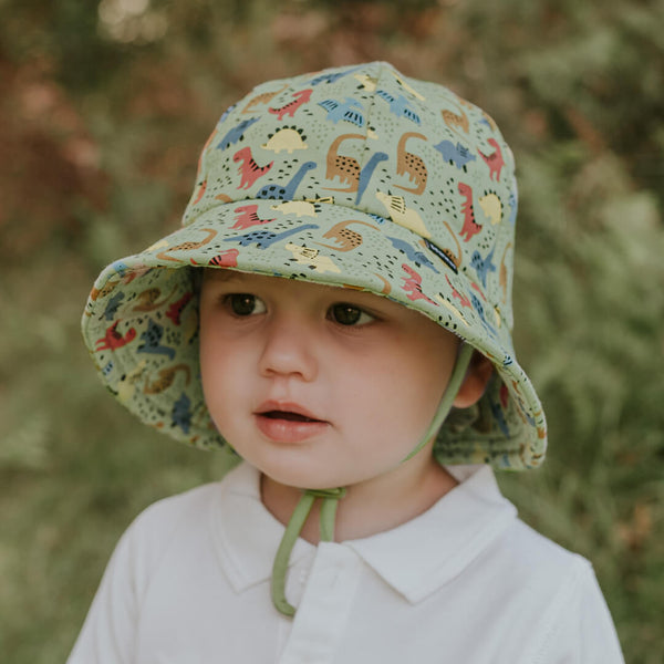 Child wearing BEDHEAD HATS Toddler Bucket Sun Hat - Dino