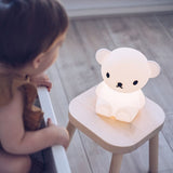 Child looking at MR MARIA Boris Bear First Light Lamp
