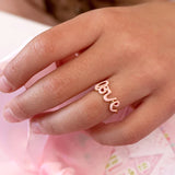 Child wearing the LAUREN HINKLEY Love Ring