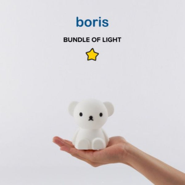 Child holding MR MARIA Boris Bear Bundle of Light