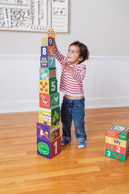 Child playing with the CROCODILE CREEK Stacking Blocks - Barnyard 123