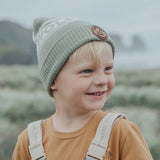 Child outside wearing the CRYWOLF Alpine Beanie - Moss side view